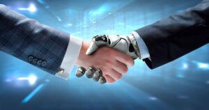 Humano y robot dándose la mano